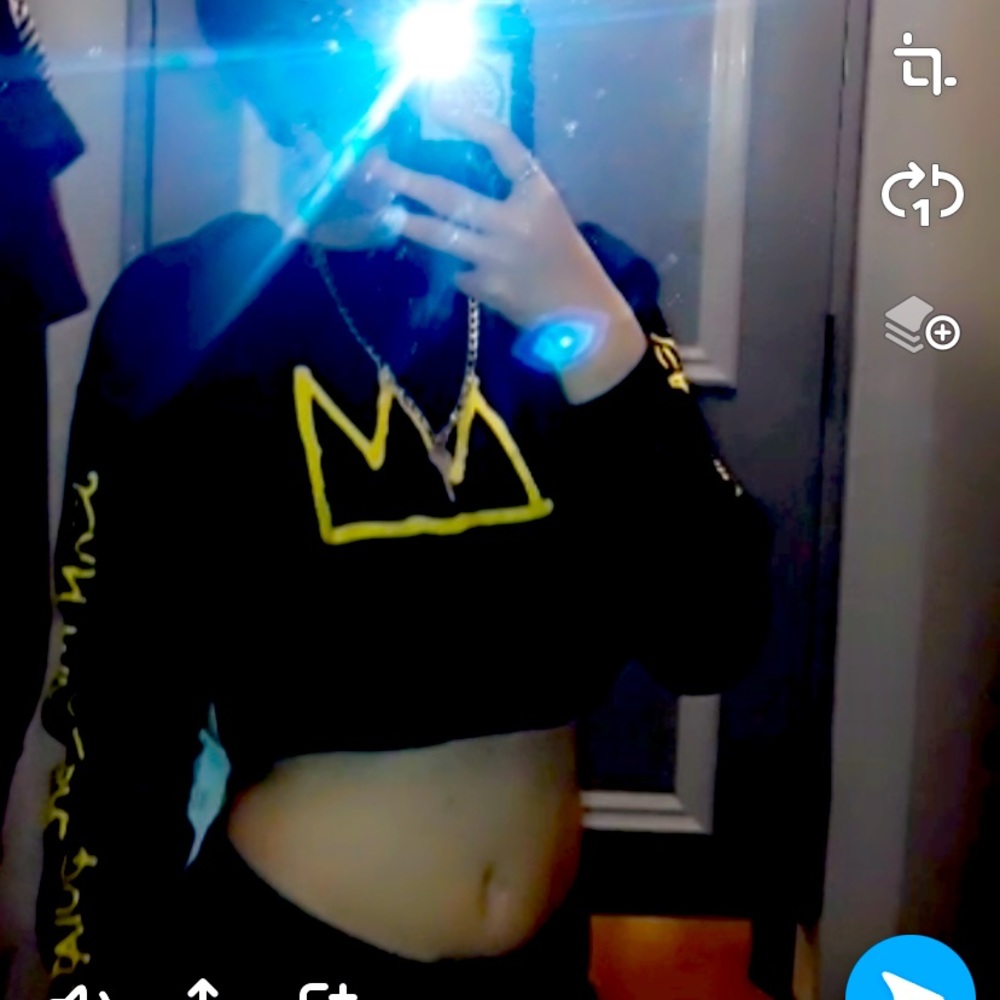 Black crop top with a crown on it